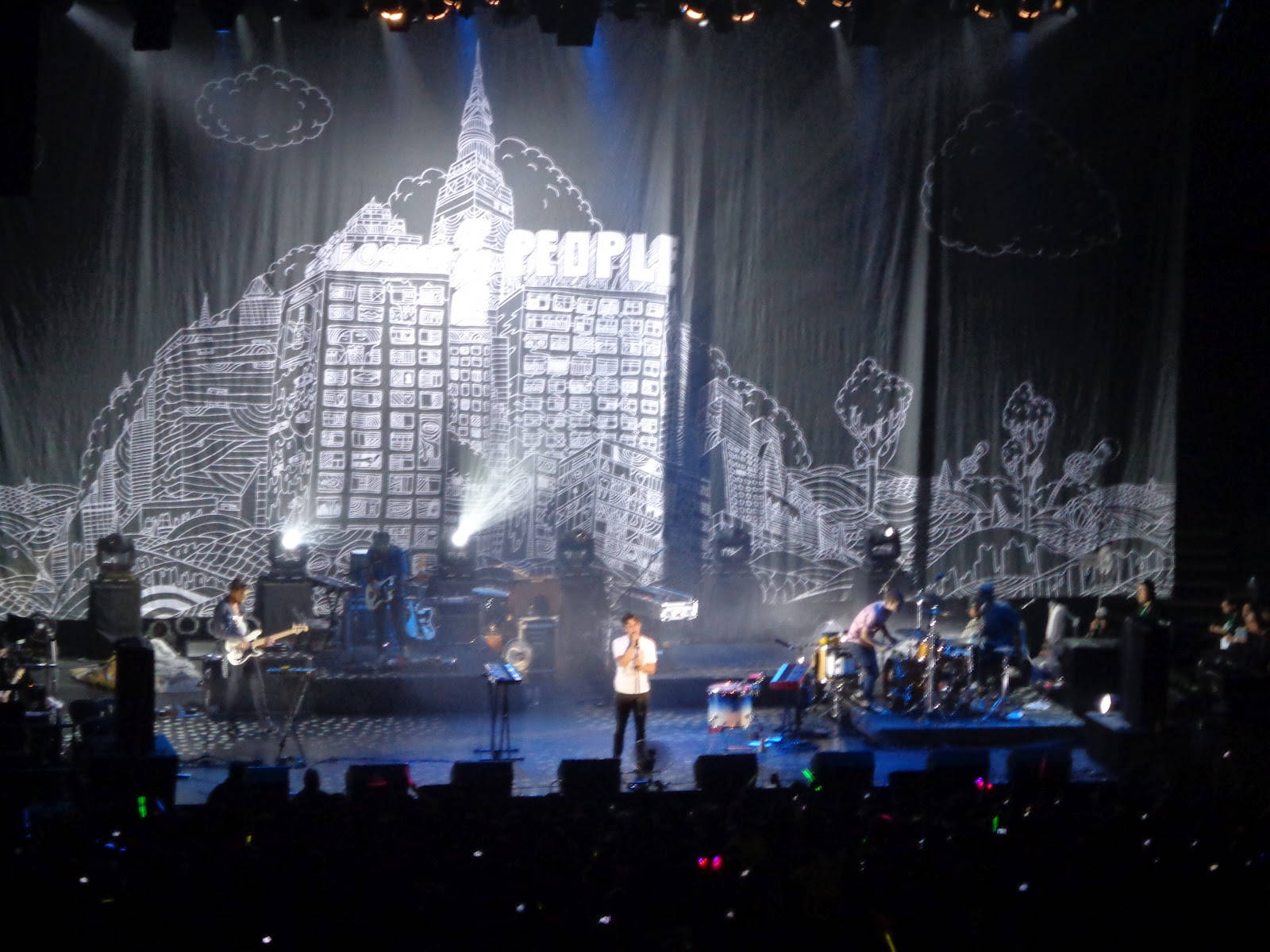 Foster The People On Concert Stage Background