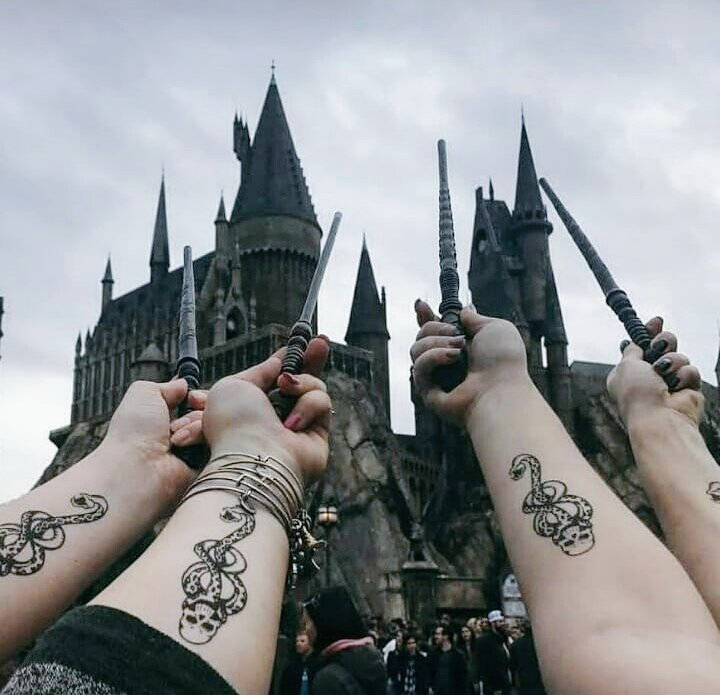 Four Arms With Slytherin Tattoo Hp Aesthetic Background