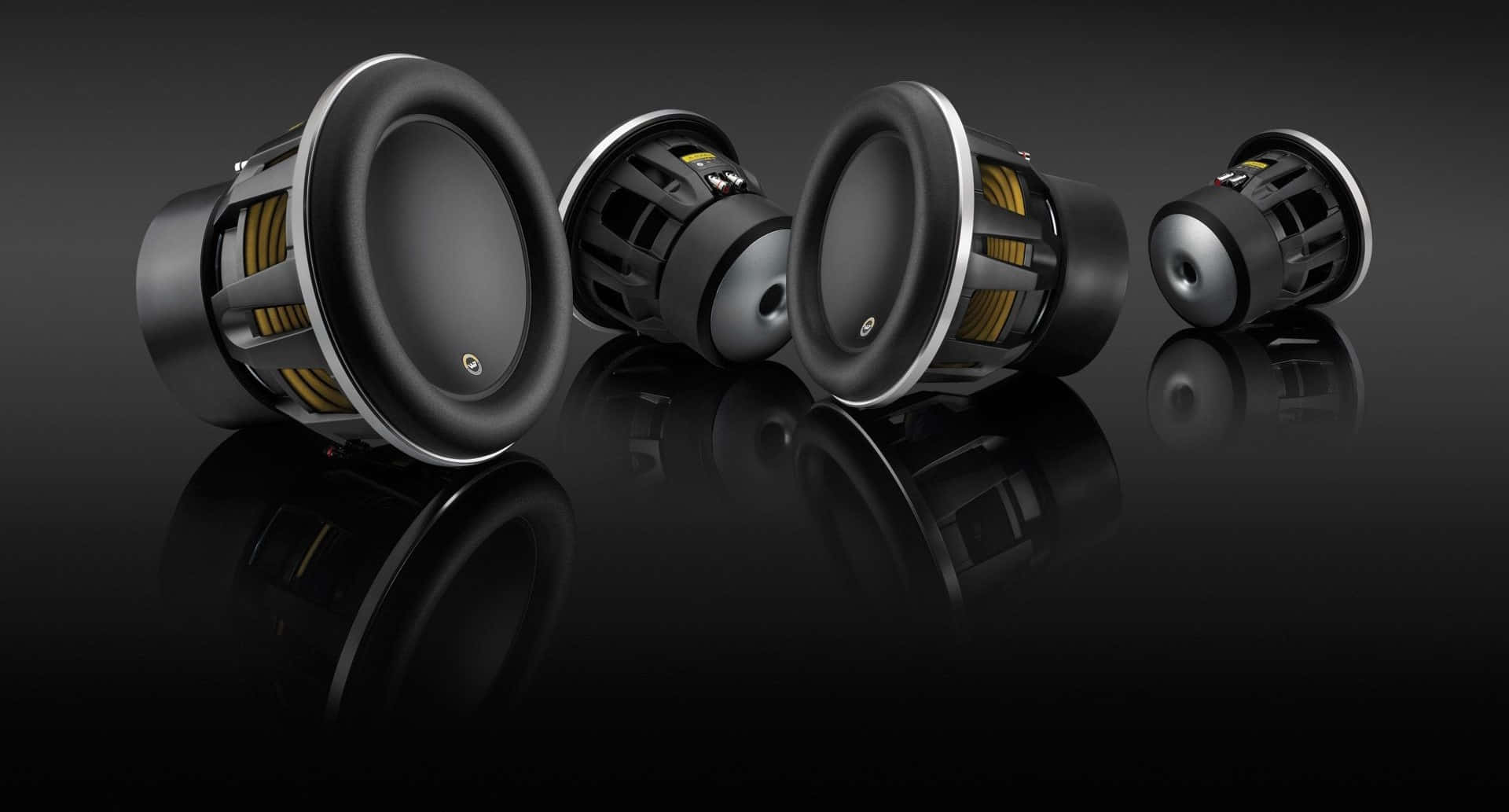 Four Black Jl Audio Speaker Parts Background