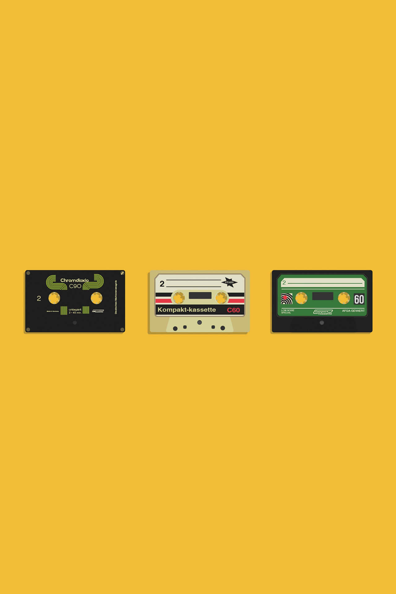 Four Cassettes On A Yellow Background Background