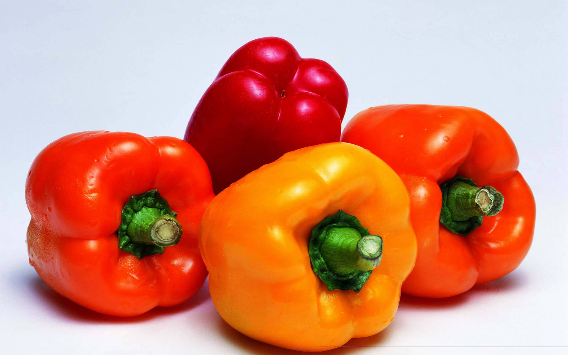 Four Fresh Bell Pepper Fruits Still