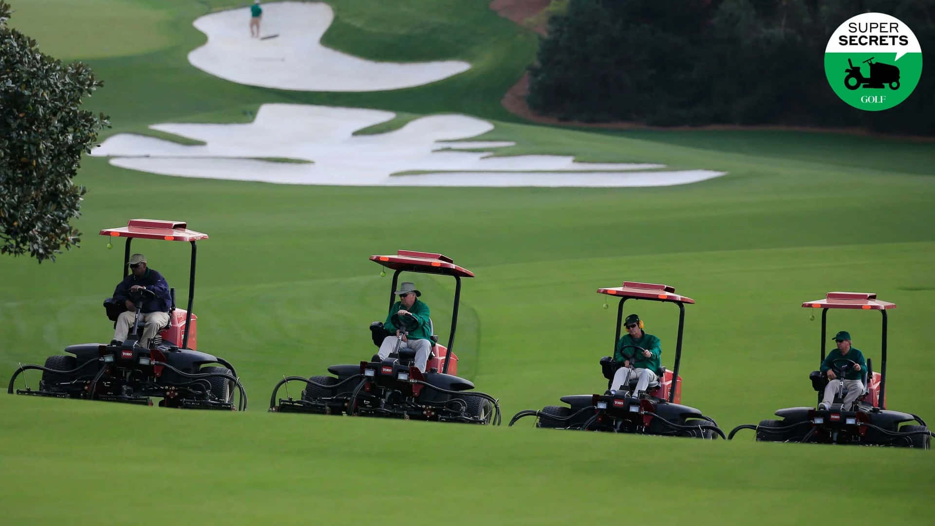 Four Golf Carts On A Green Grassy Field Background