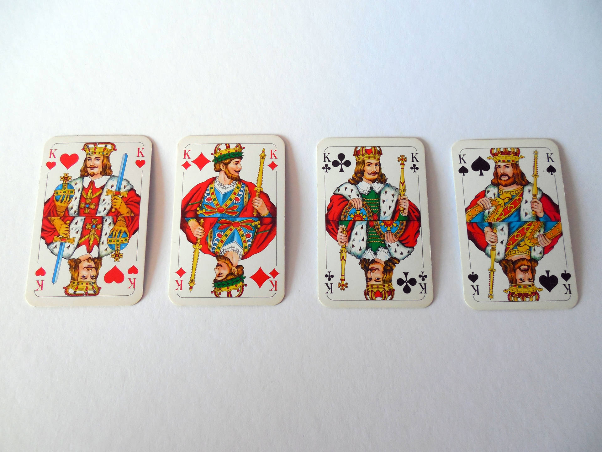 Four Kings Playing Cards Background