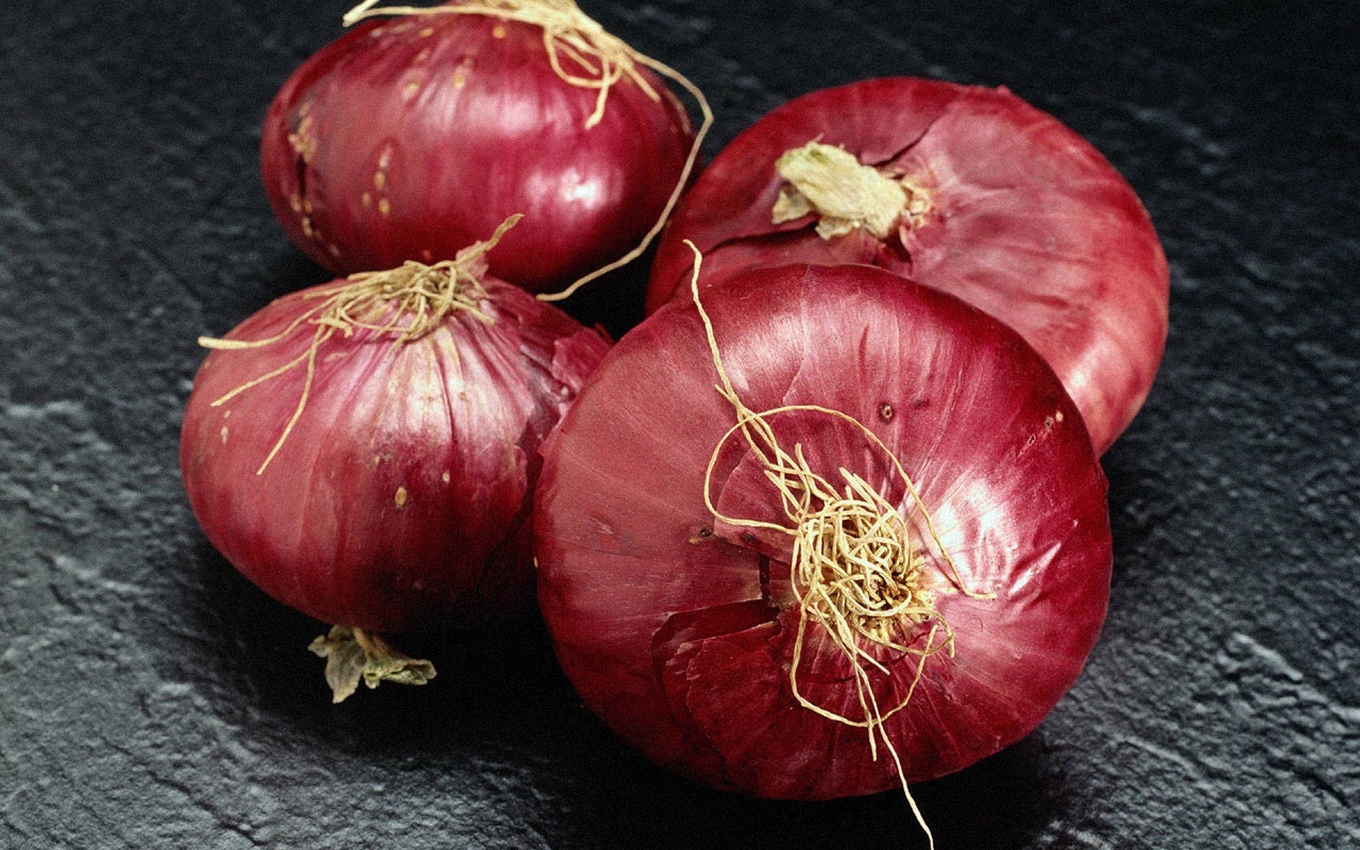 Four Red Onions Background