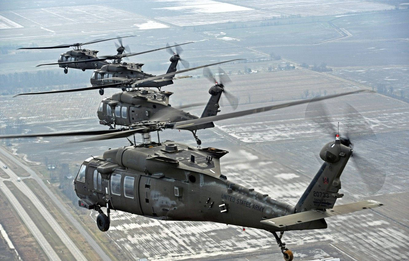 Four Uh-60m Black Hawk Helicopters Background