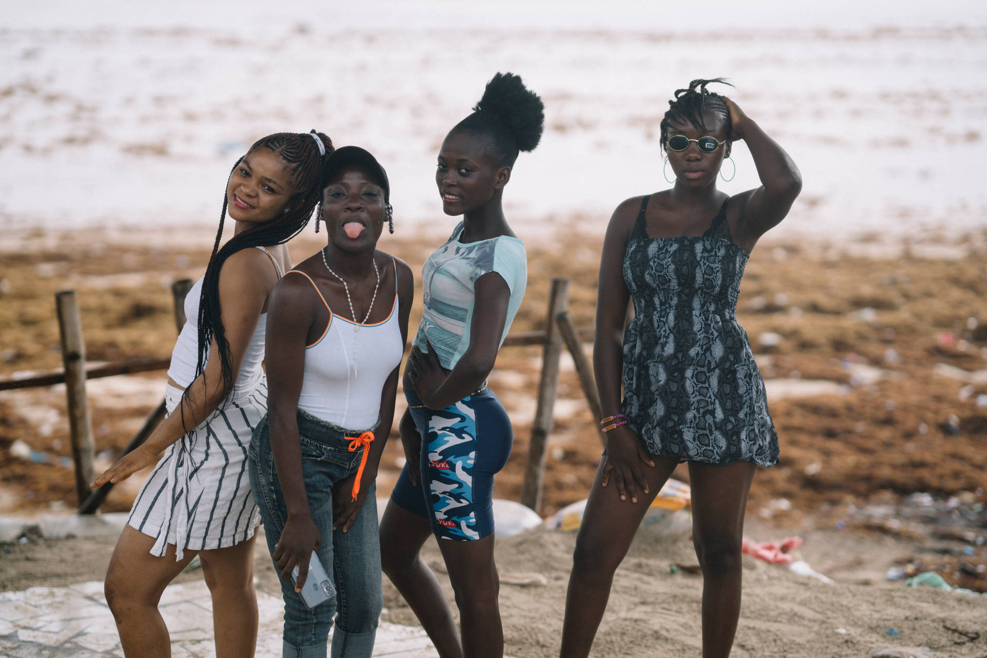 Four Women Posing At Beach In Sierra Leone Background