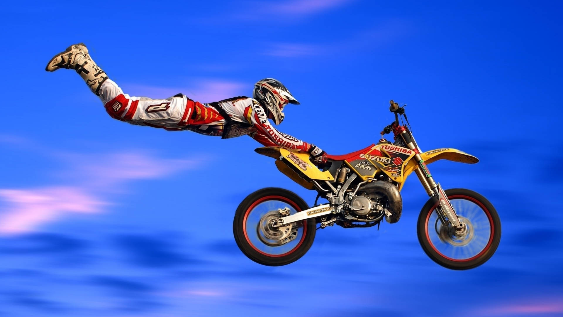 Fox Racing Dirt Bike Flying Stunt Background