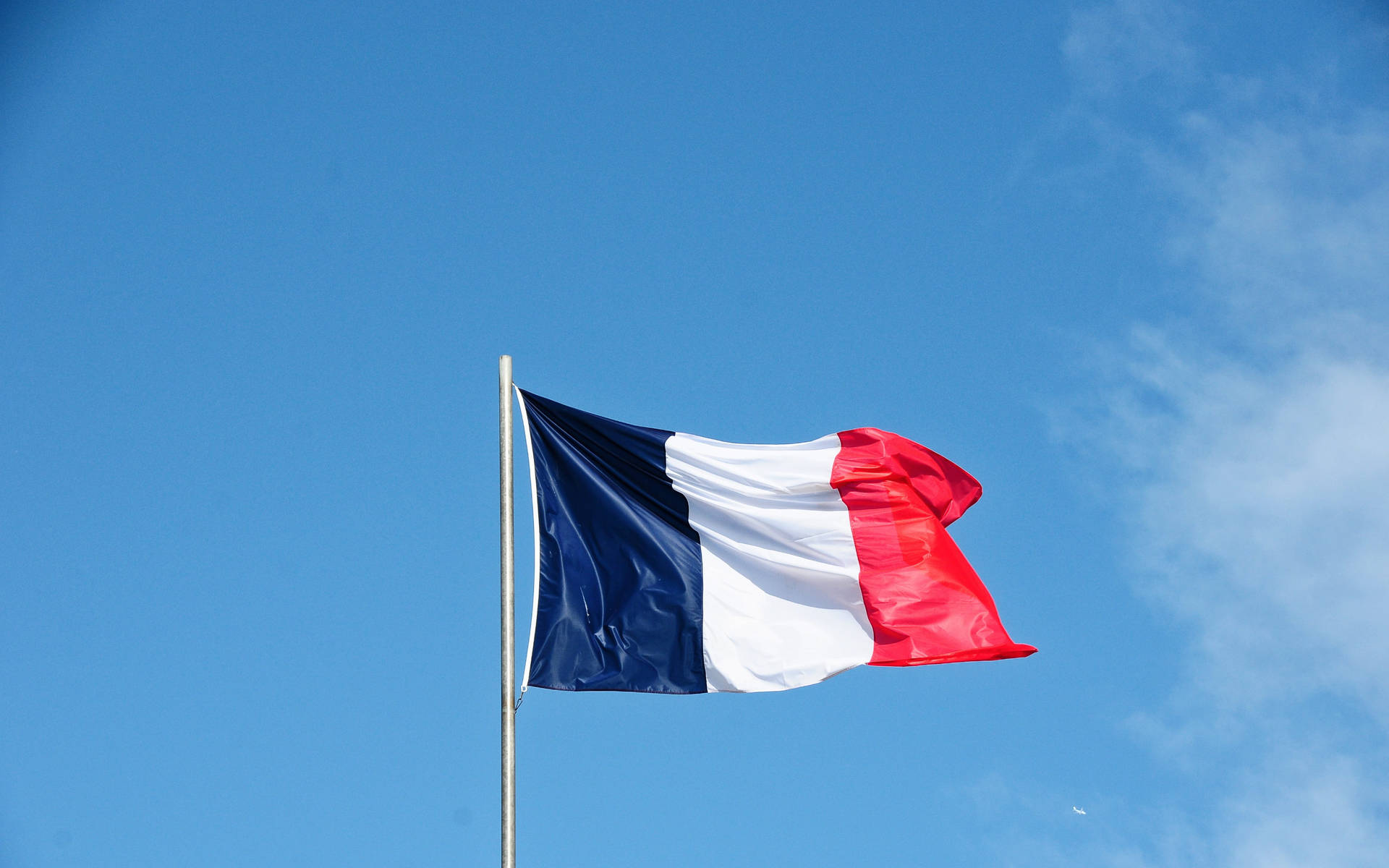 France Flag Waving On Wind Background