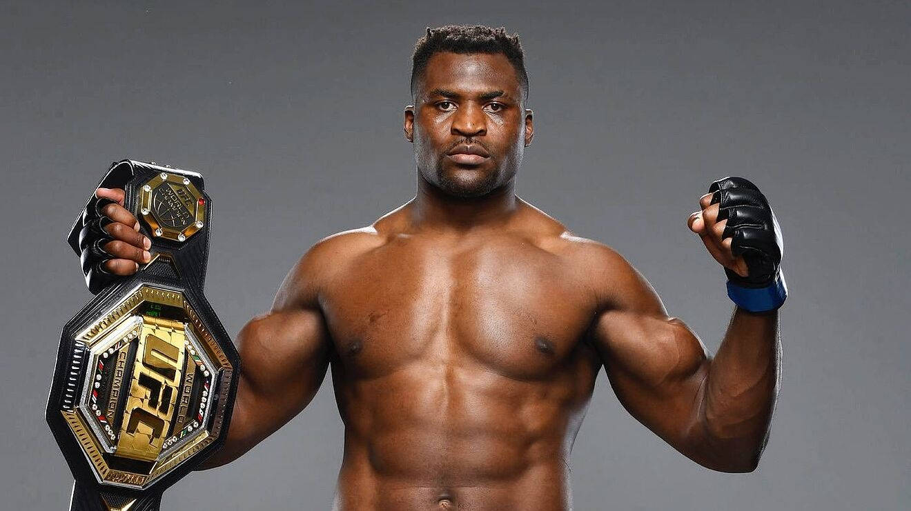 Francis Ngannou Holding Championship Belt Background