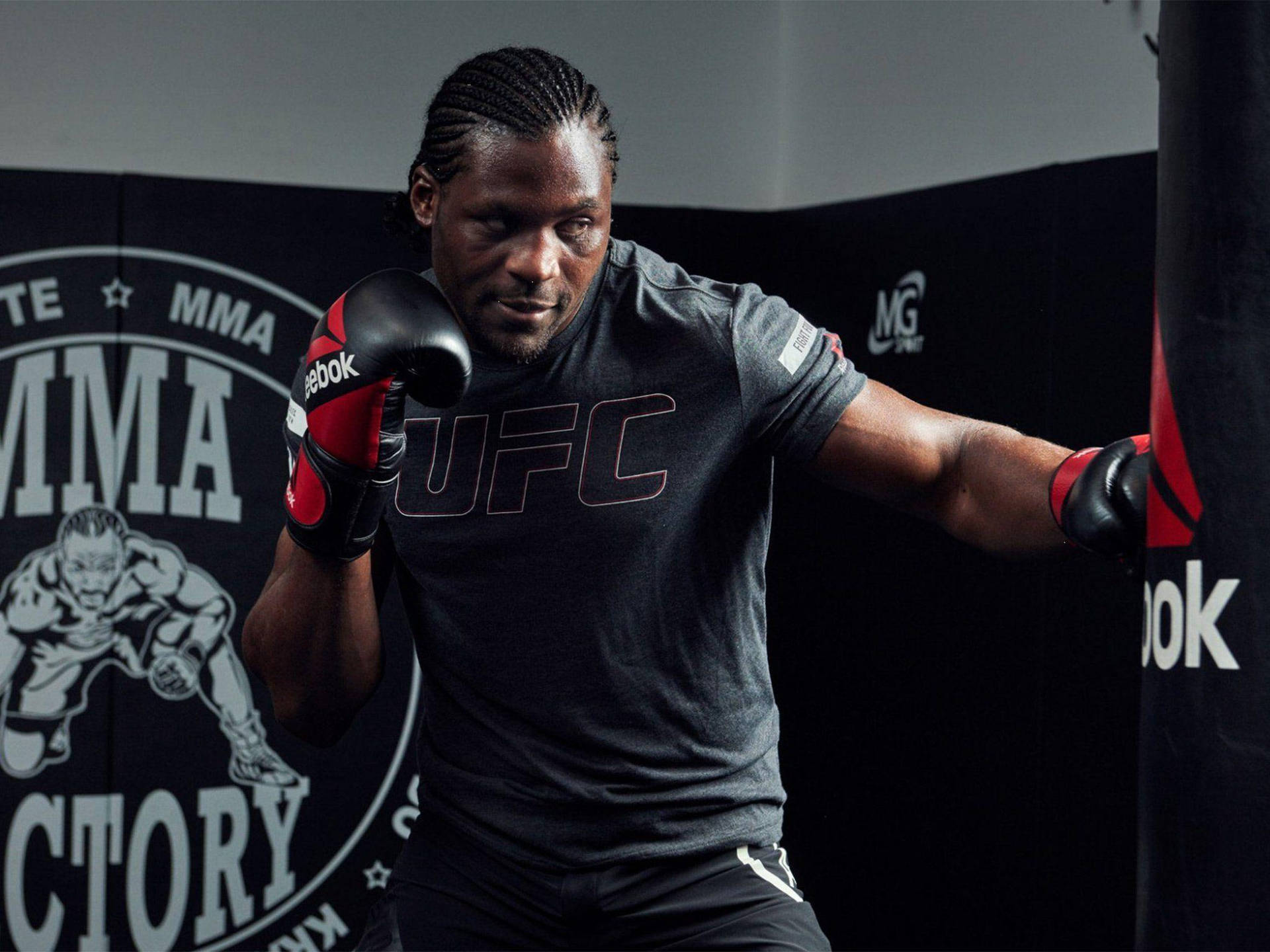 Francis Ngannou Punching Bag Background