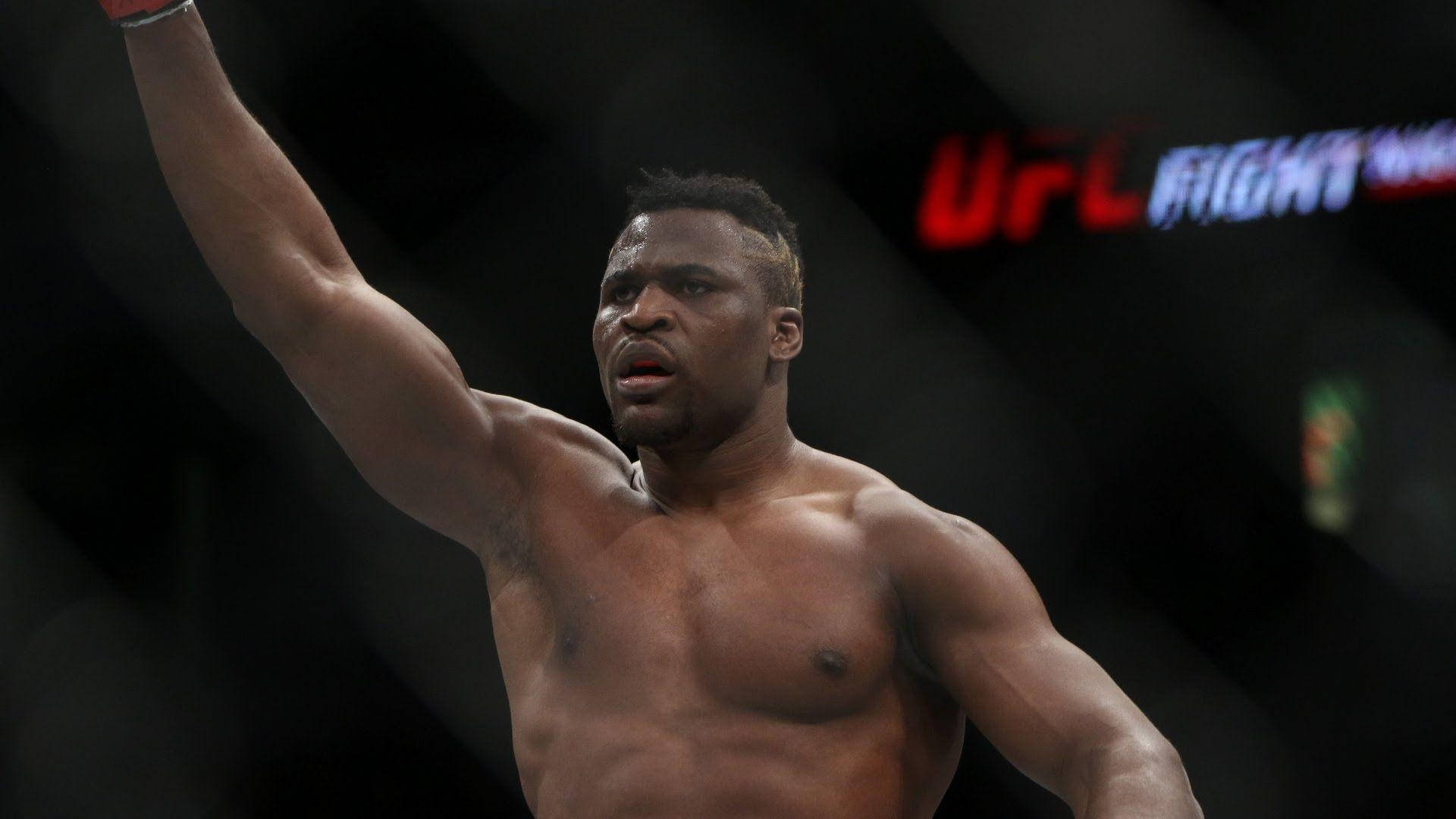 Francis Ngannou Raises Arm Background