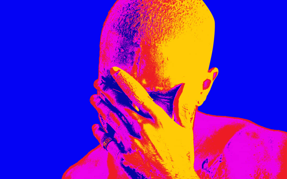 Frank Ocean Standing In A Studio With His Laptop. Background