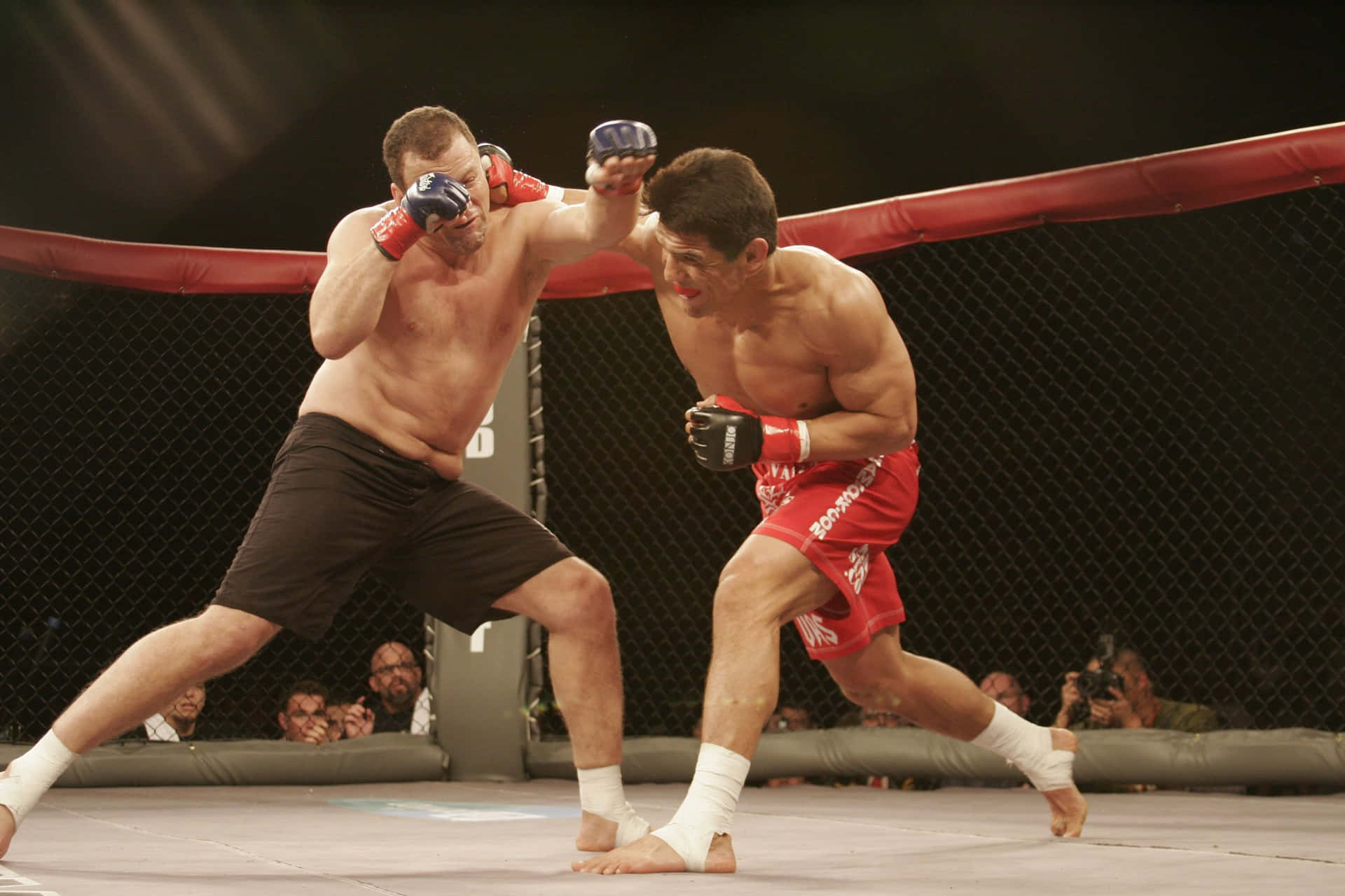 Frank Shamrock Landing An Overhand Punch On Cesar Gracie During A Match