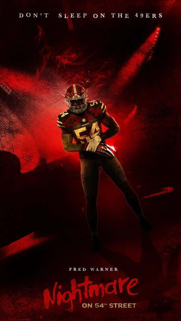 Fred Warner Dominating On Field In A Night Game Background