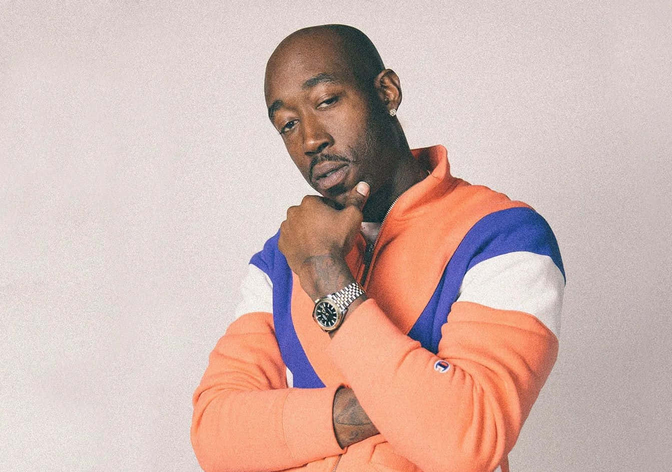 Freddie Gibbs Contemplative Pose Background