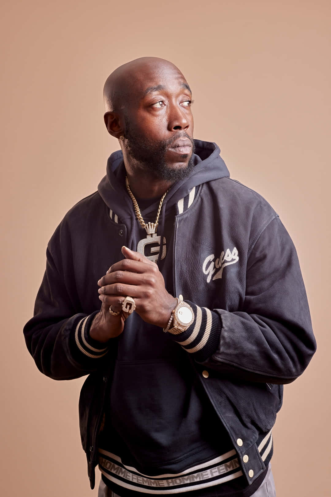 Freddie Gibbs Contemplative Pose Background