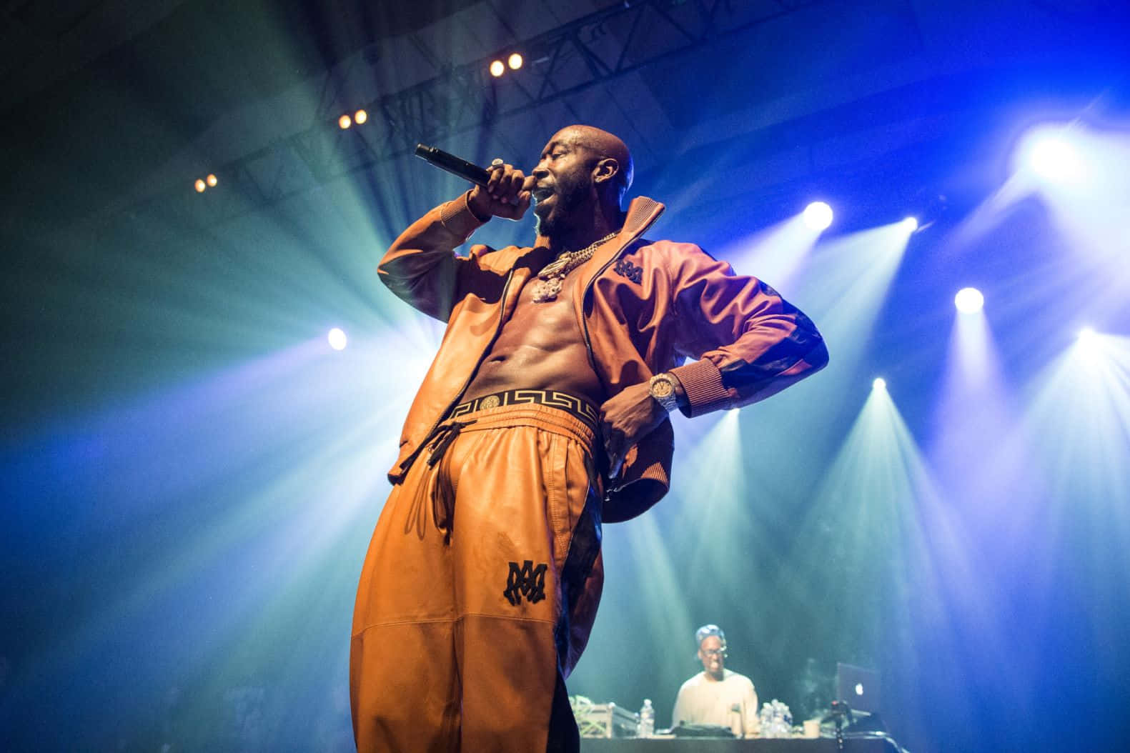 Freddie Gibbs Performing Liveon Stage Background