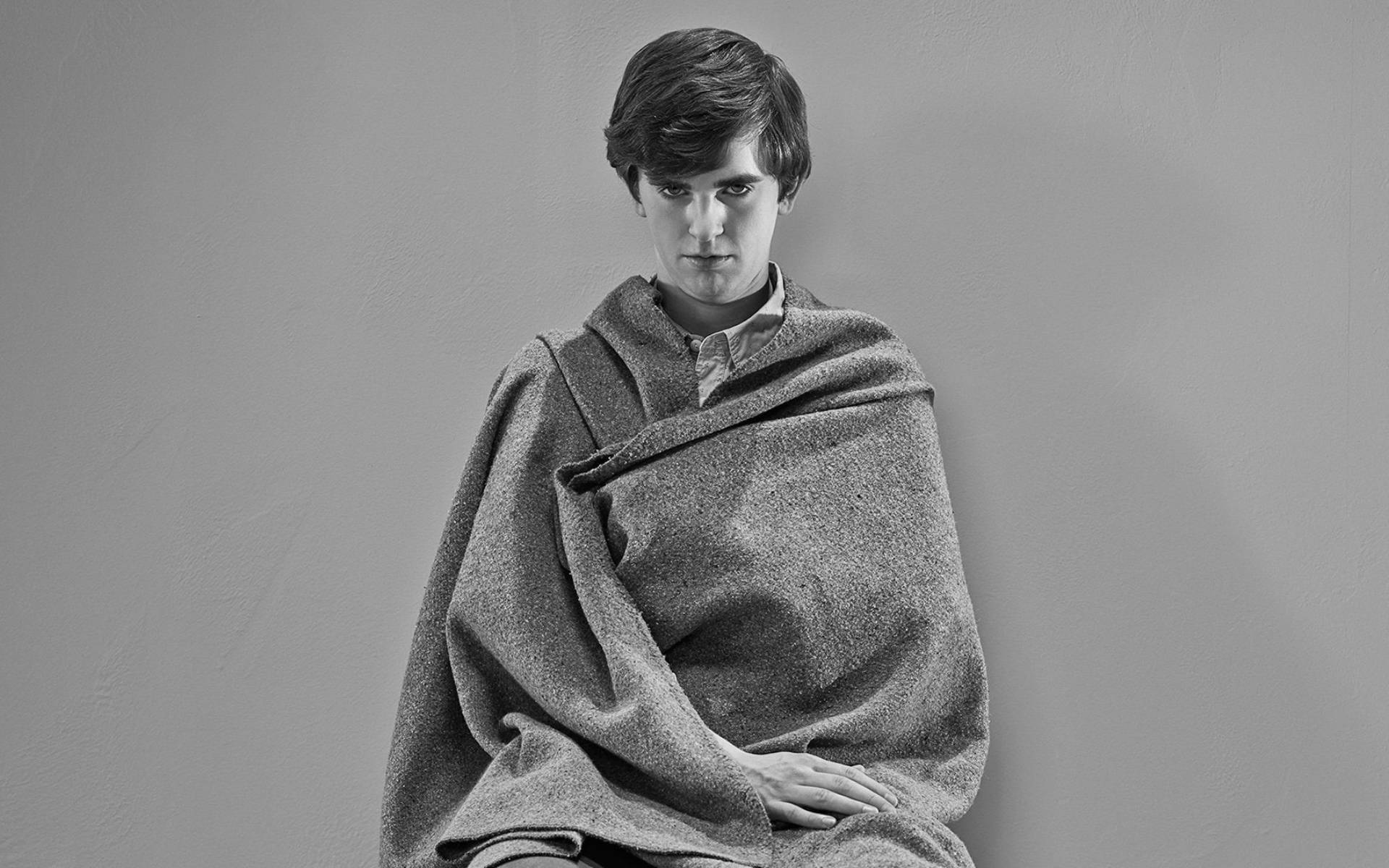 Freddie Highmore Wrapped With Blanket Background