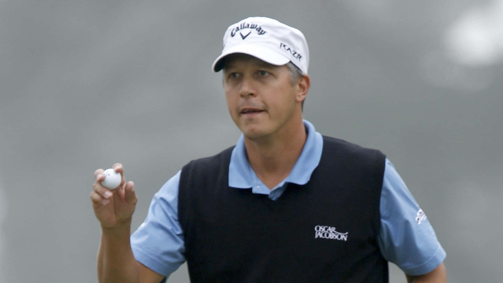 Freddie Jacobson Holding Golf Ball Background