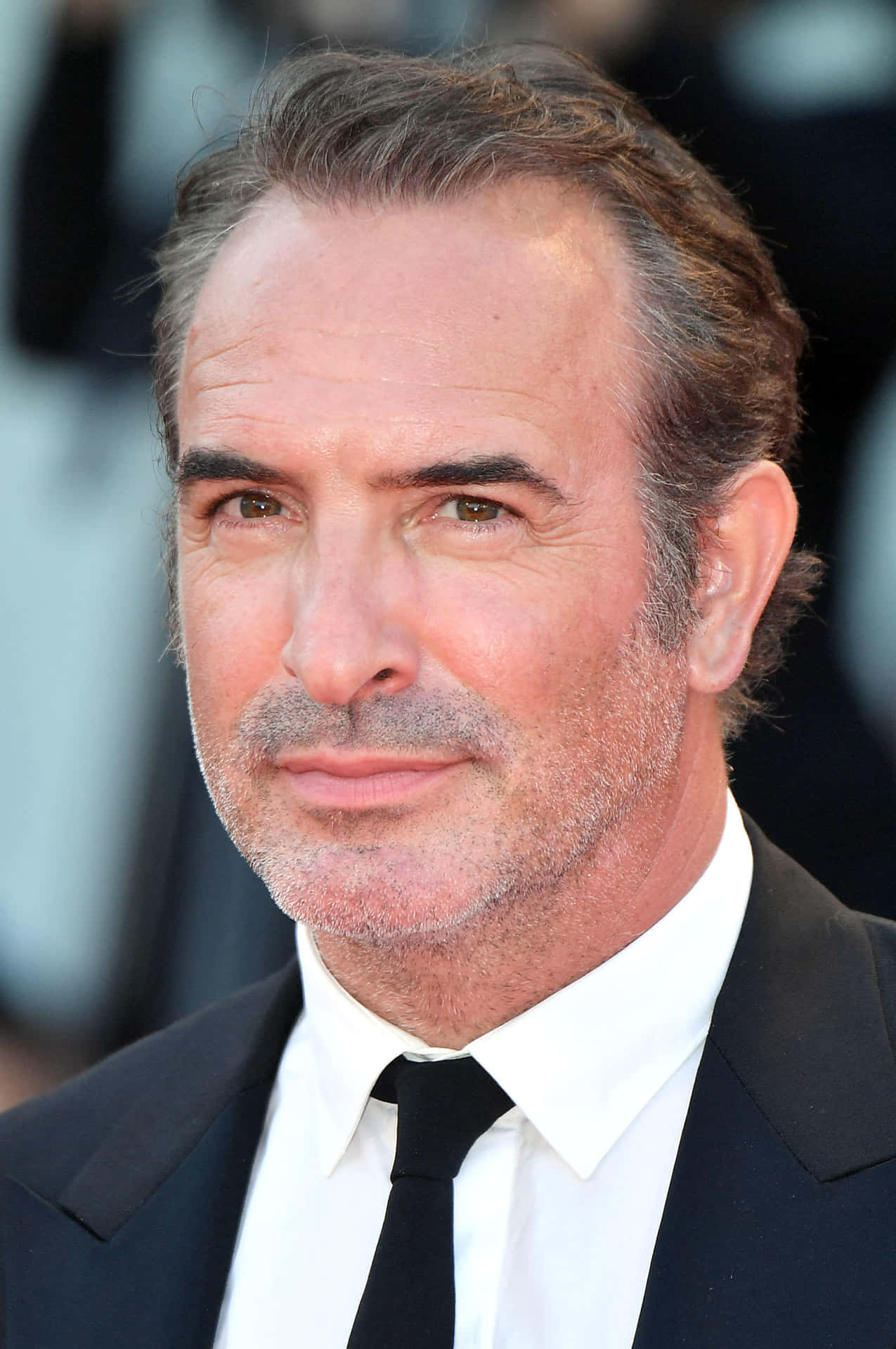 French Actor Jean Dujardin At A Press Event Background