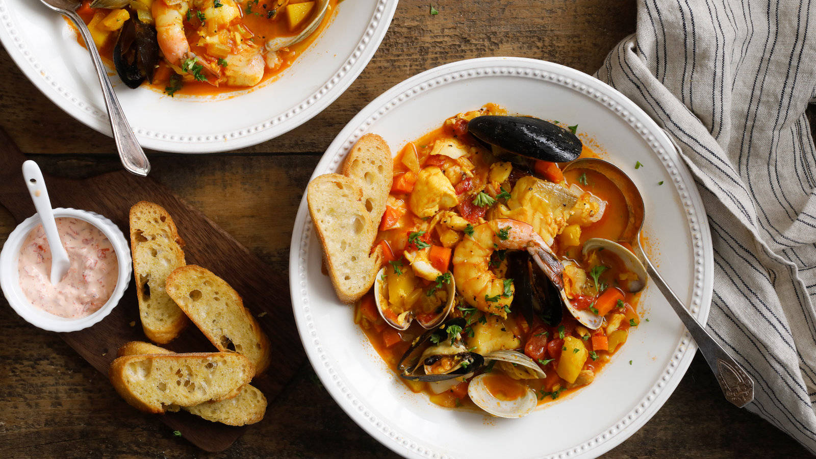 French Dish Bouillabaisse And Bread With Dip Background