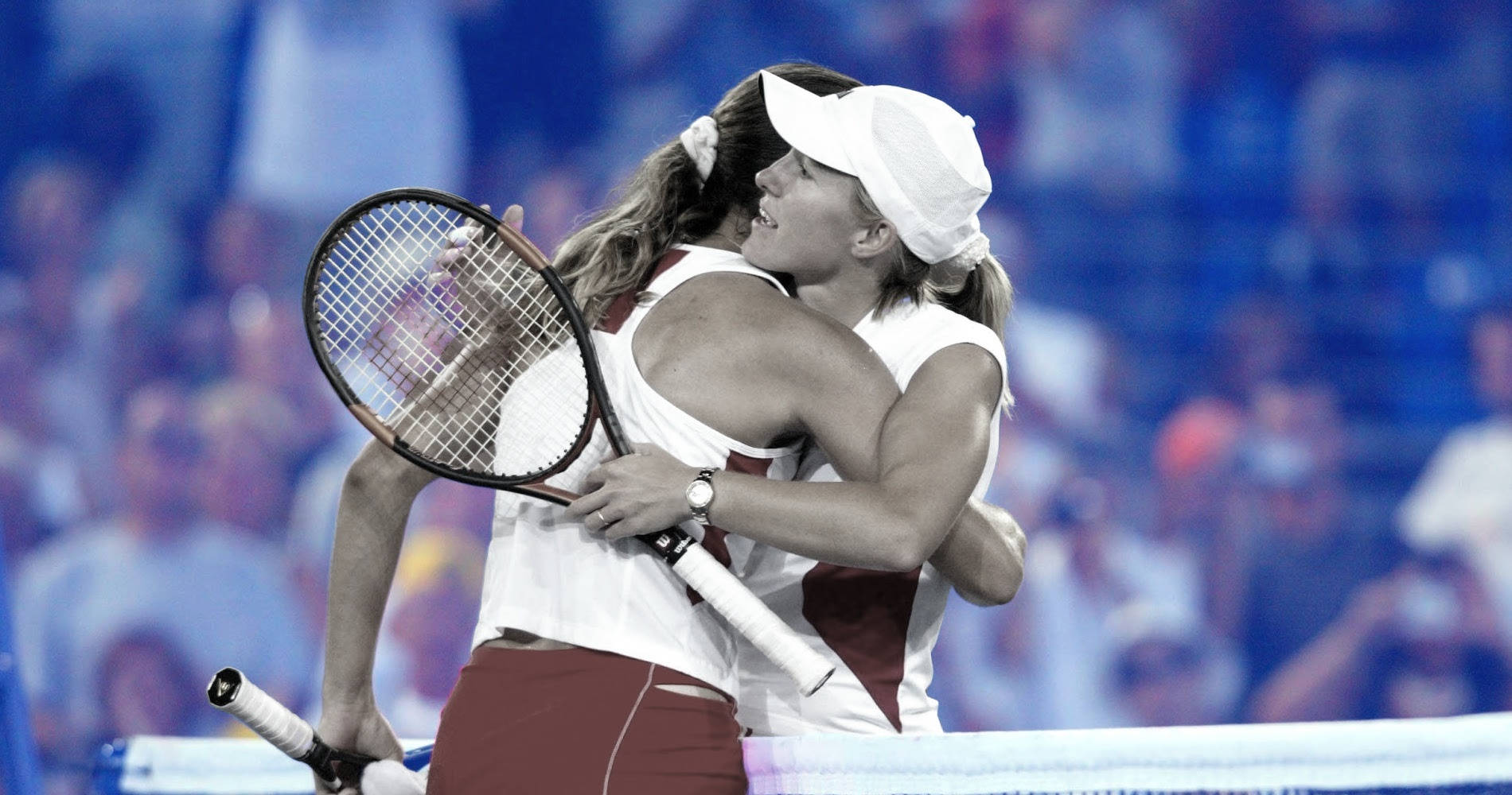 French Tennis Player Amélie Mauresmo And Belgian Star Justine Henin Disputing A Point During A Tennis Match Background