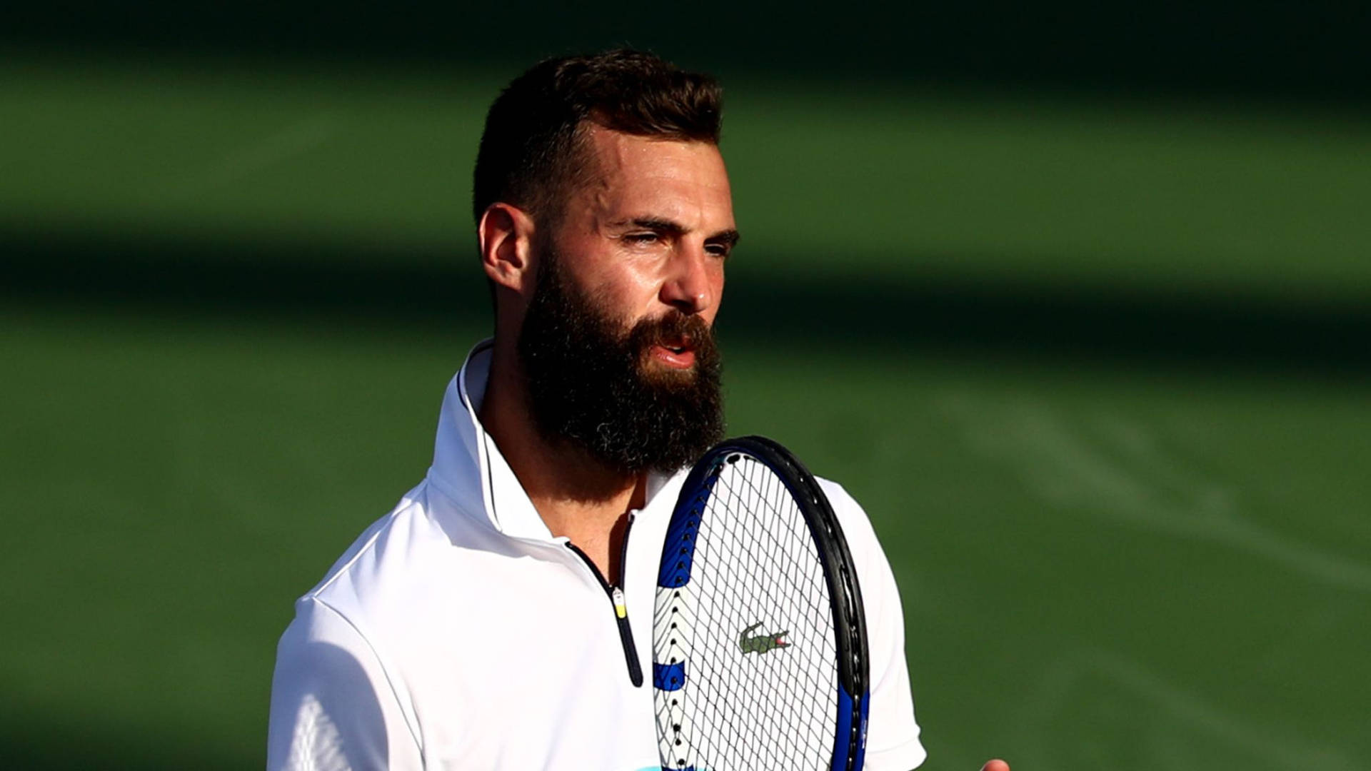 French Tennis Star Benoit Paire In Action On Tennis Court. Background