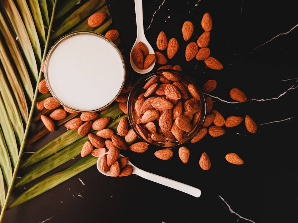 Fresh Almond Milk In A Glass Background