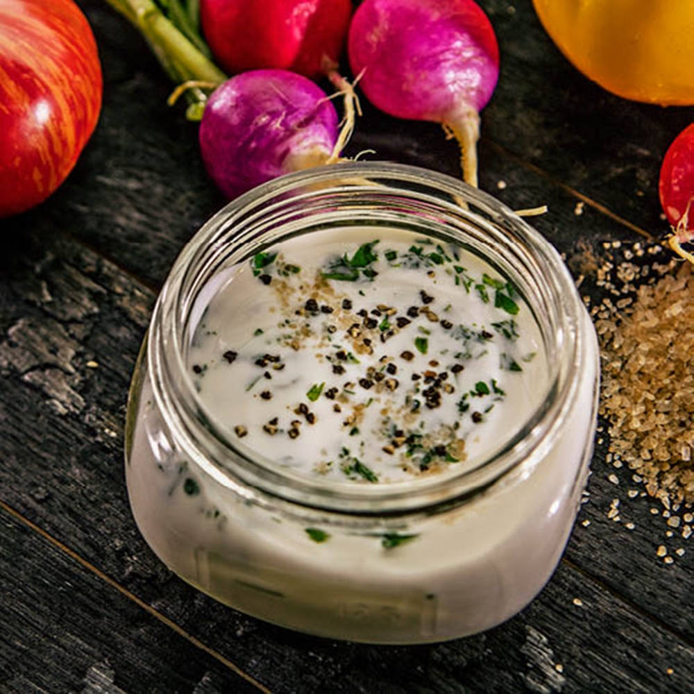 Fresh Buttermilk In A Vintage Jar Background