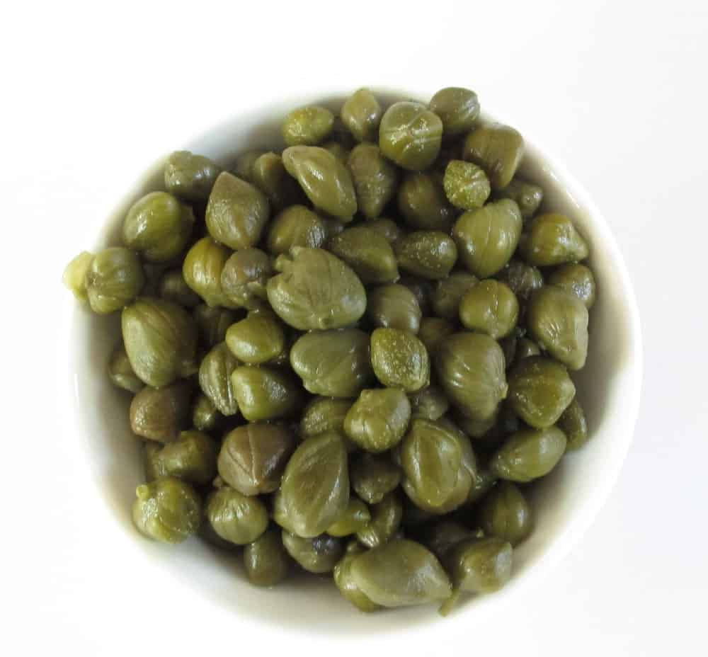 Fresh Caper Buds In A Bowl Background