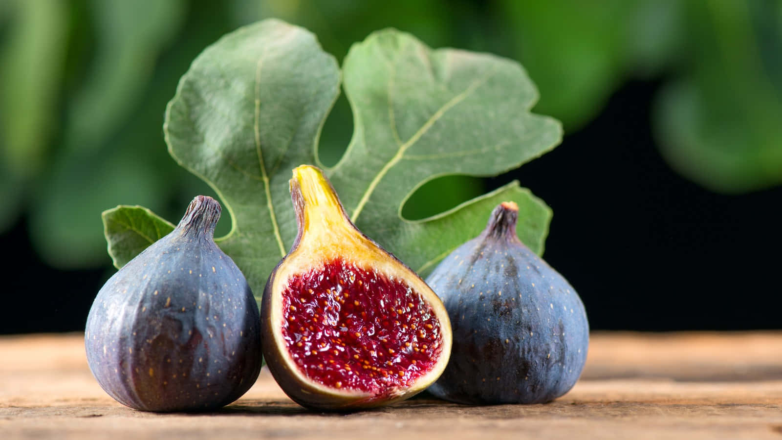 Fresh Figs With Leaves Background