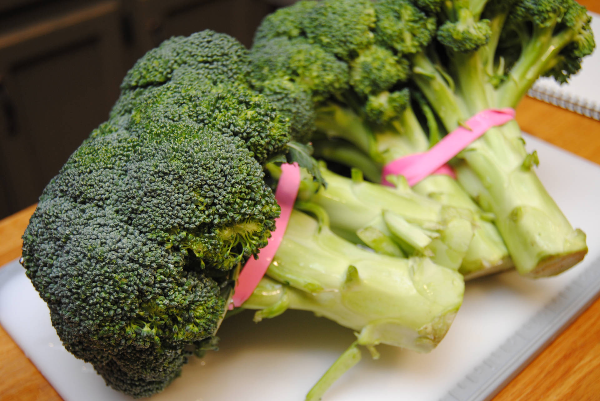 Fresh Green Broccoli With Pink Tie Background