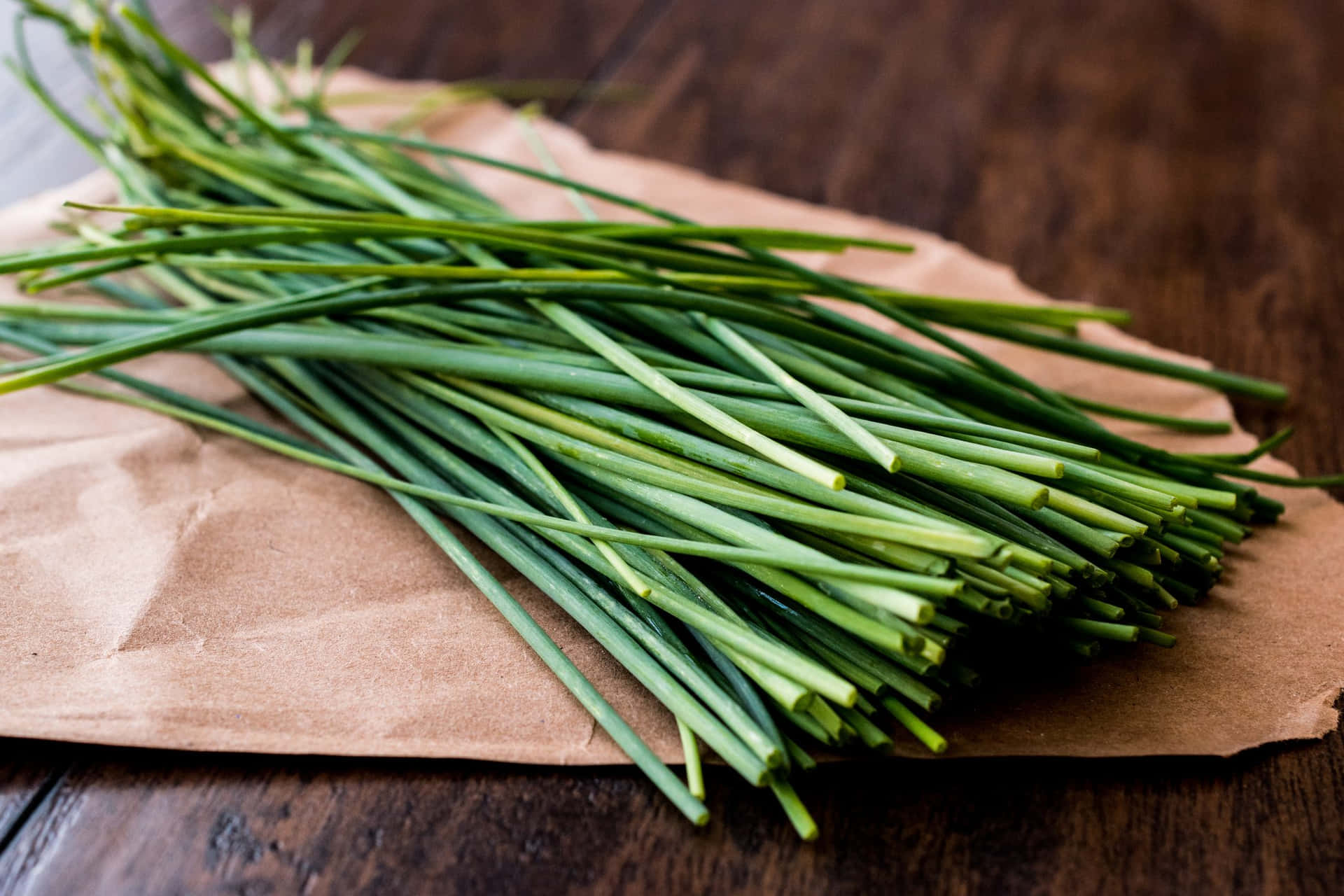 Fresh Green Chives On Brown Paper Background