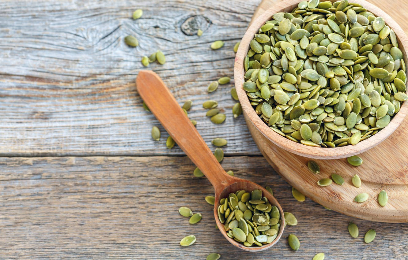 Fresh Green Lentils In Wooden Bowl And Spoon Background