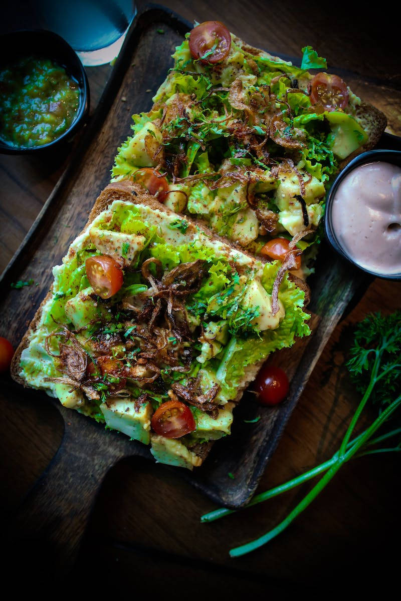 Fresh Green Lettuce On Bread Background