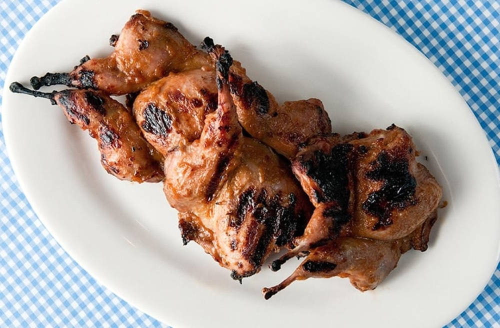 Fresh Grilled Quail On Oval Platter Background