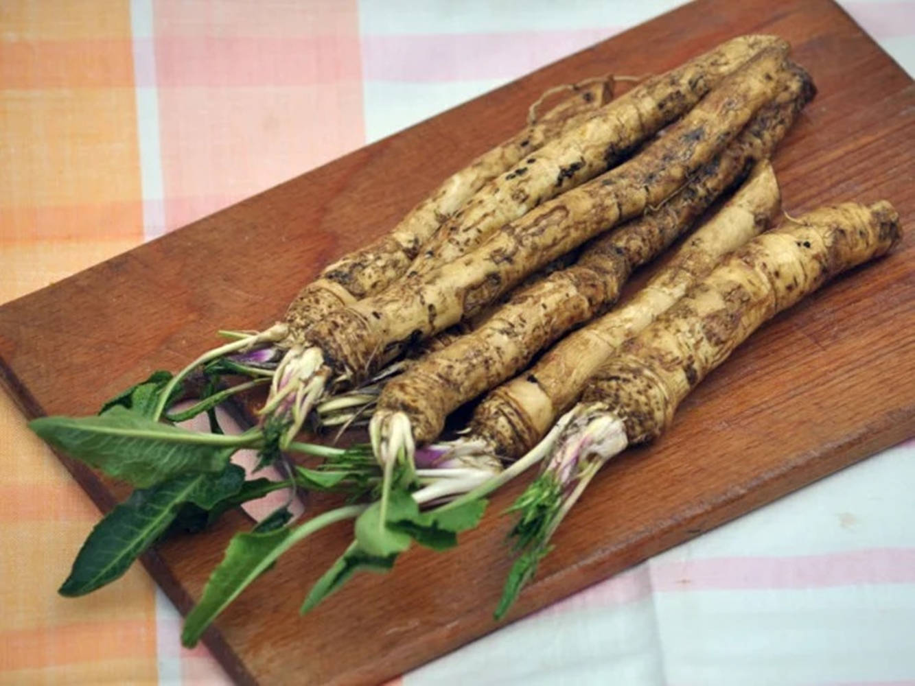 Fresh Horseradish On Chopping Board Background