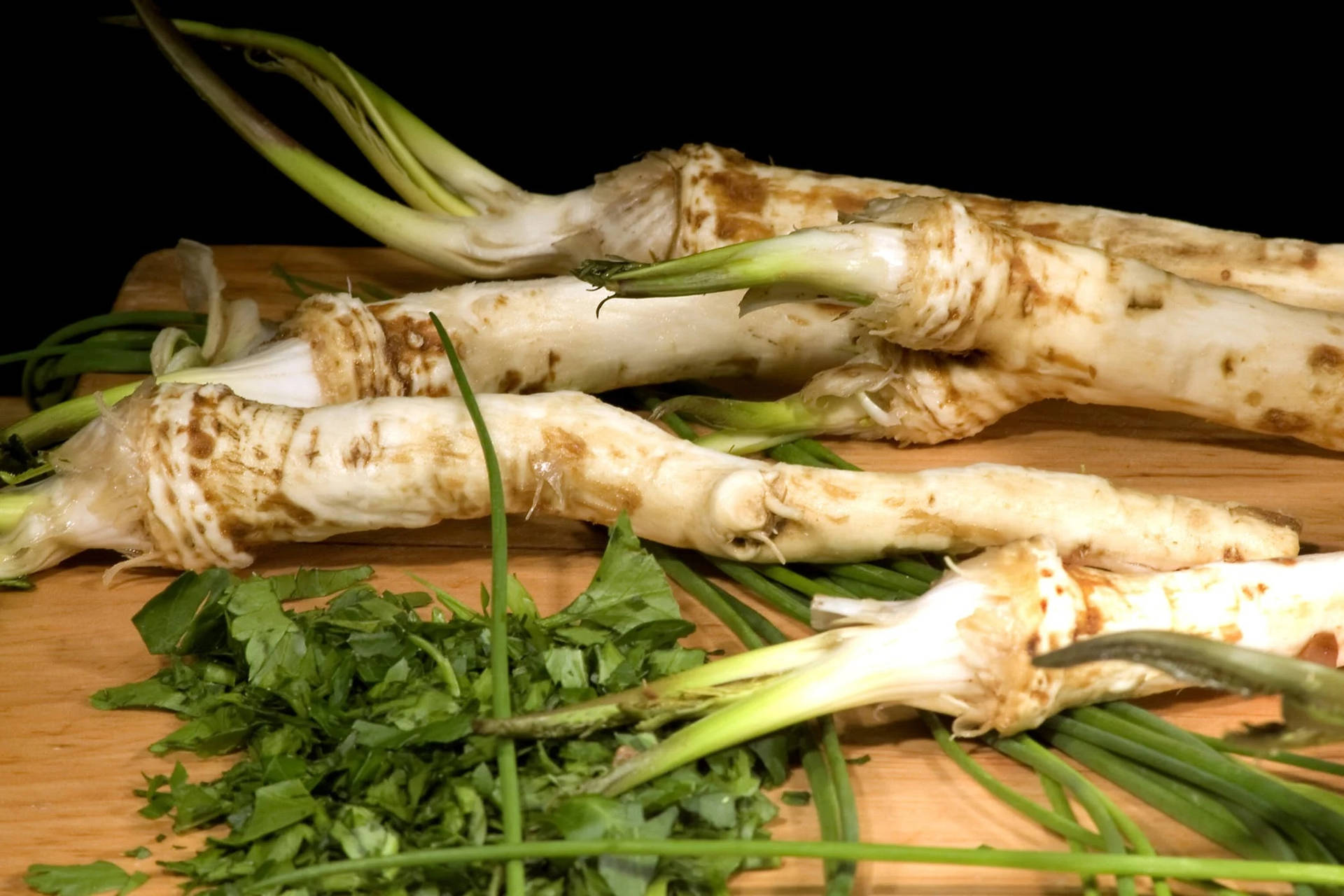 Fresh Horseradish Root On A Chopping Board Background