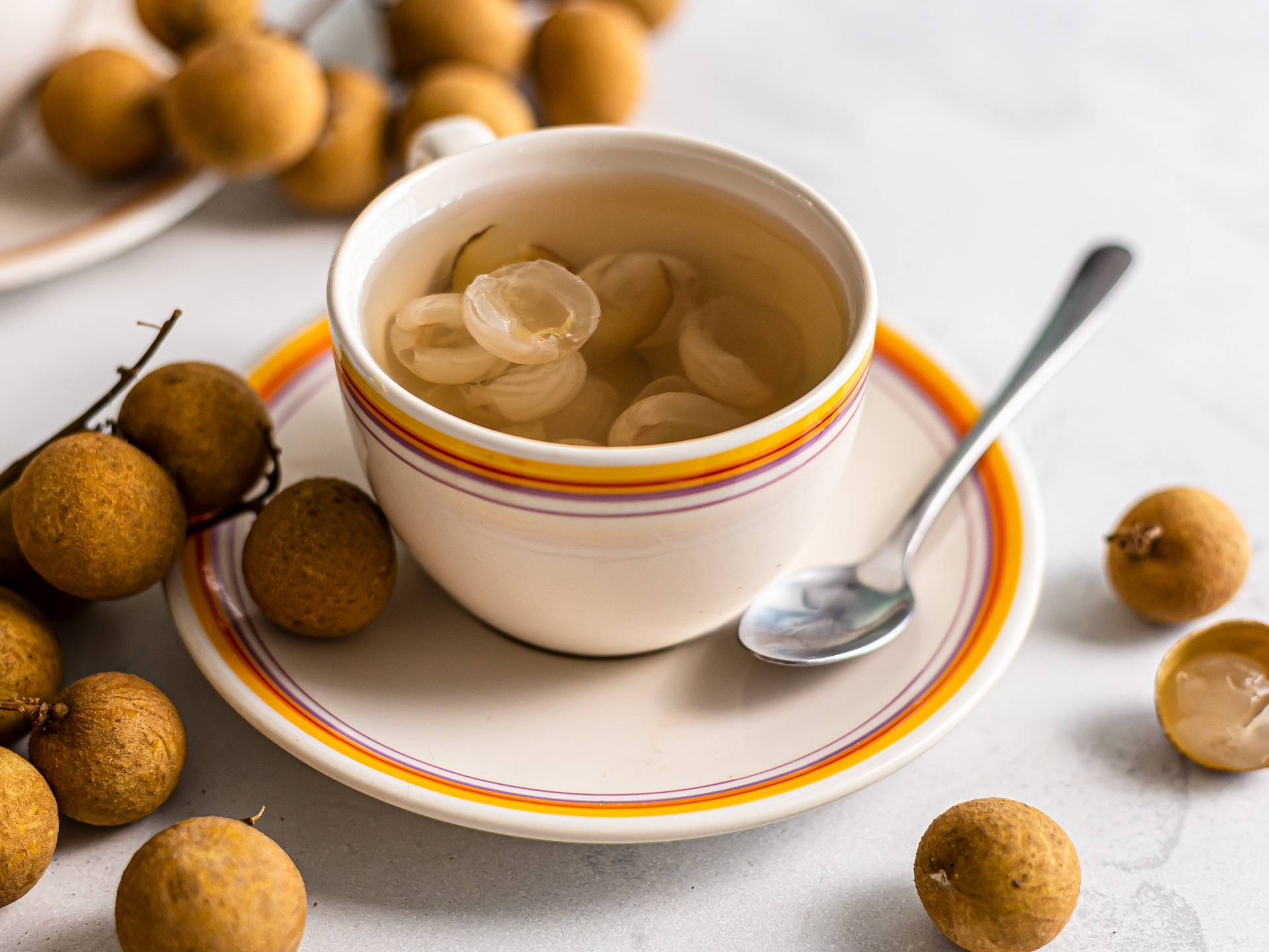 Fresh Longan Fruits Immersed In Tea