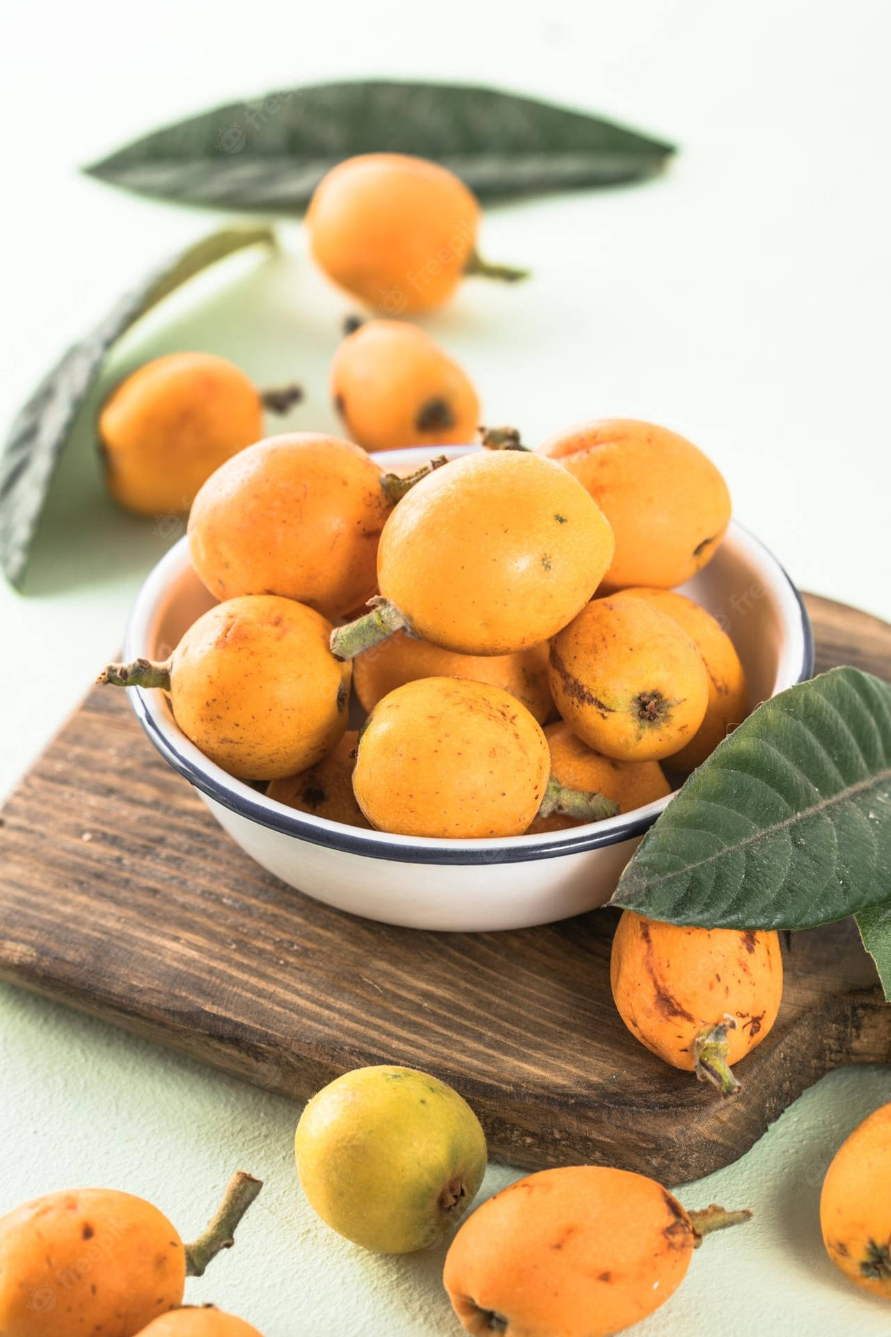 Fresh Loquat Fruits On A Chopping Board Background