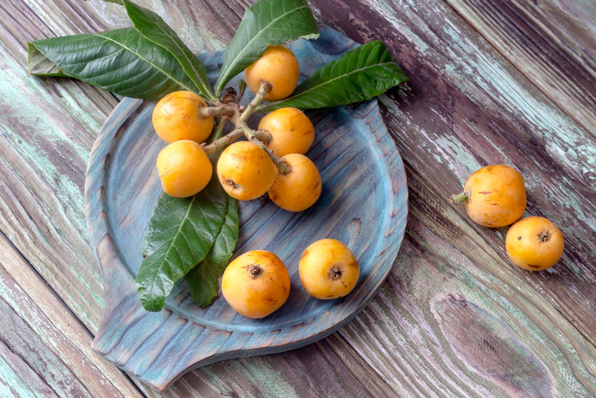 Fresh Loquat Fruits Placed On A Marble Plate Background