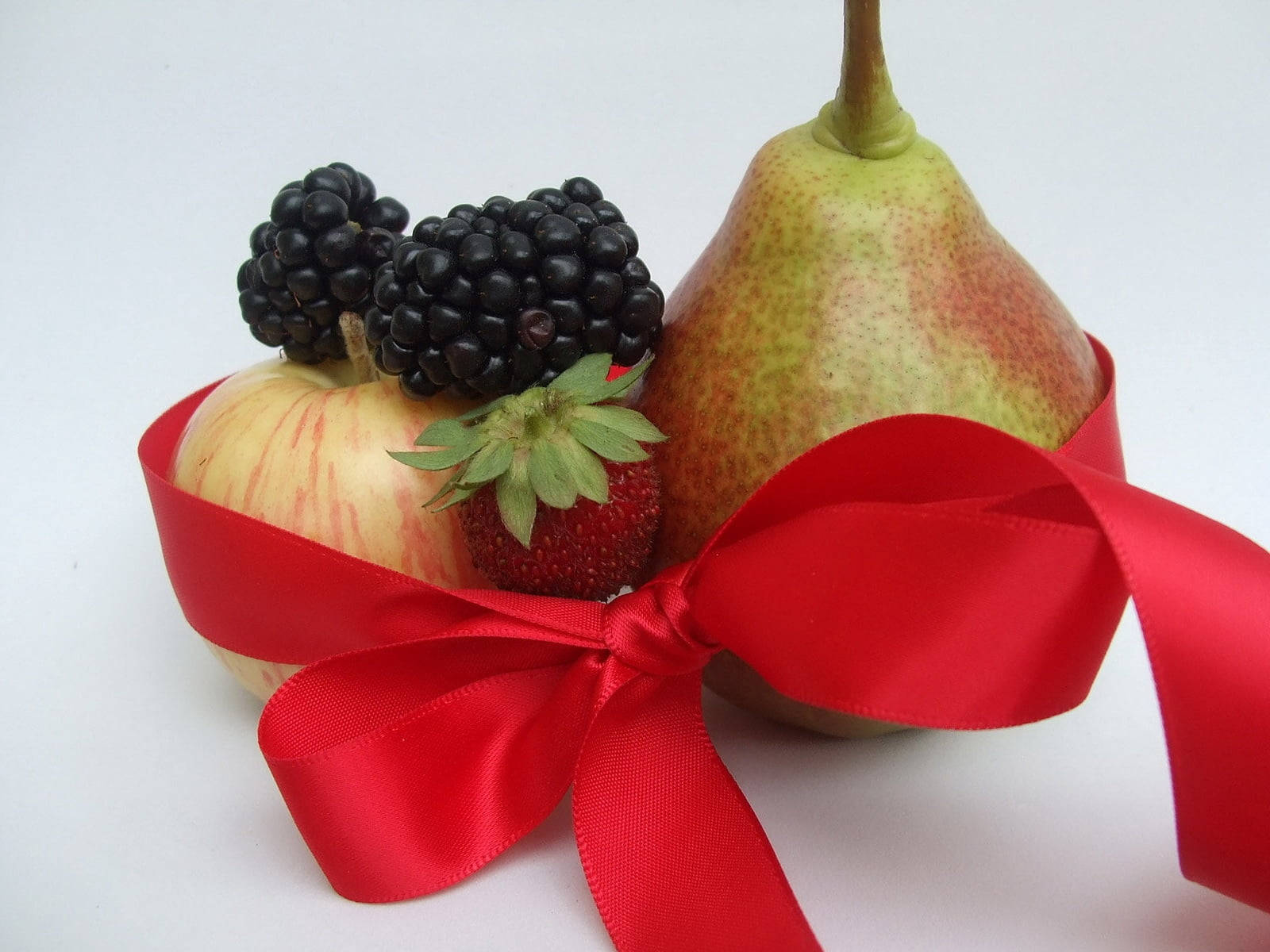 Fresh Mulberry Fruits Adorned With A Red Ribbon Background