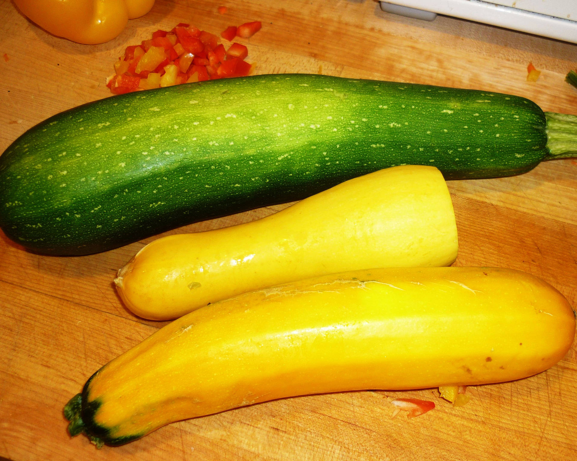 Fresh Organic Yellow Squash And Zucchini On A Rustic Table Background