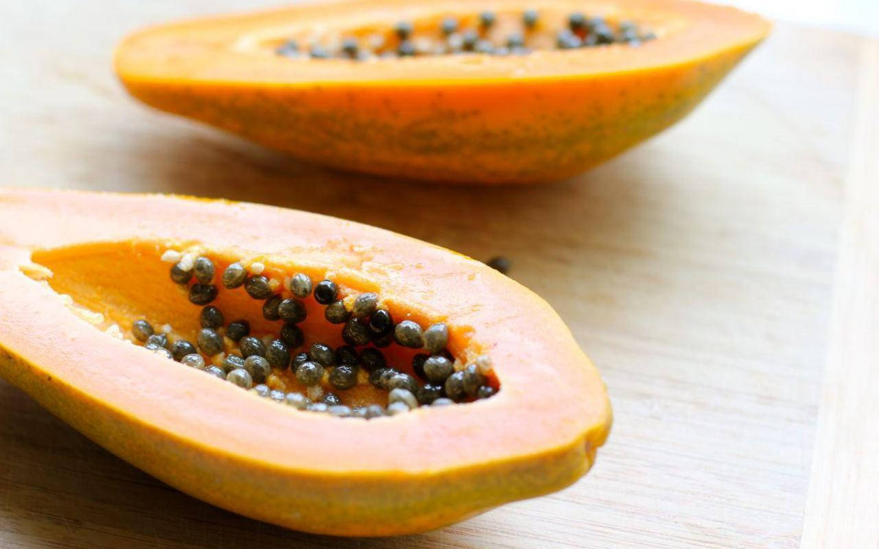 Fresh Papaya Fruit On Table Background