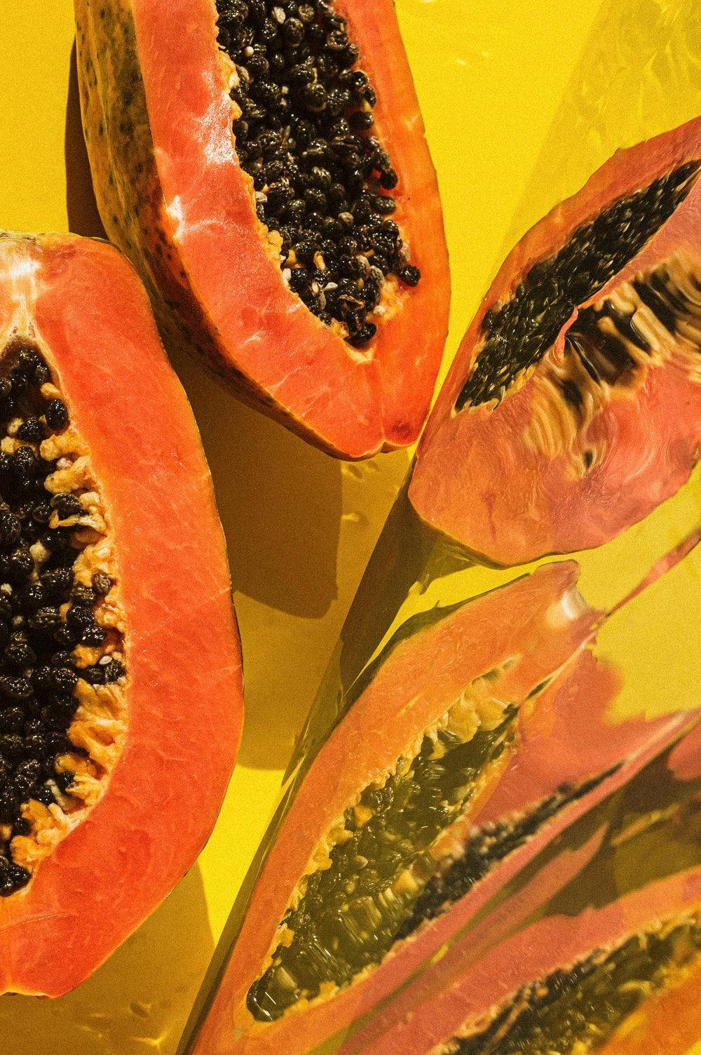 Fresh Papaya Fruits Vibrant Yellow Background