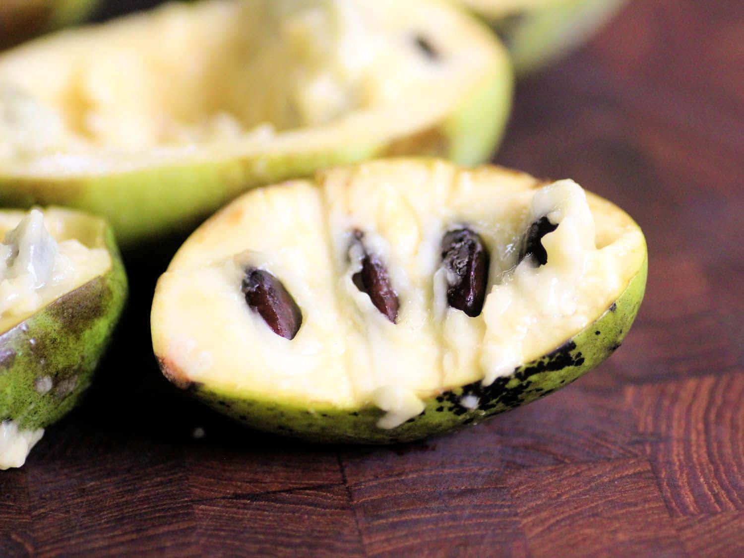 Fresh Pawpaw Fruit Halves Background