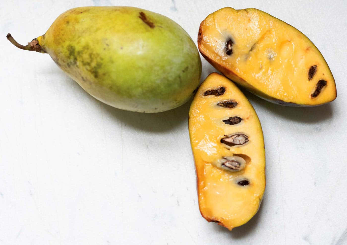 Fresh Pawpaw Fruitand Slices.jpg Background