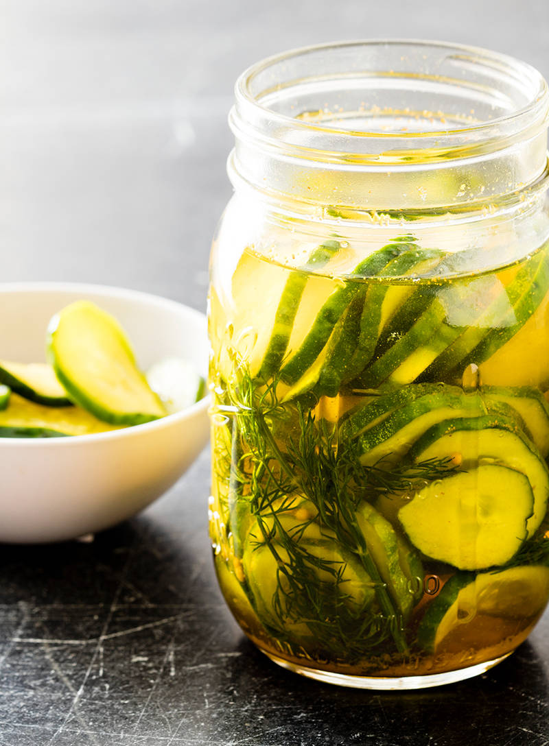 Fresh Pickled Cucumber Slices In A Mason Jar Background