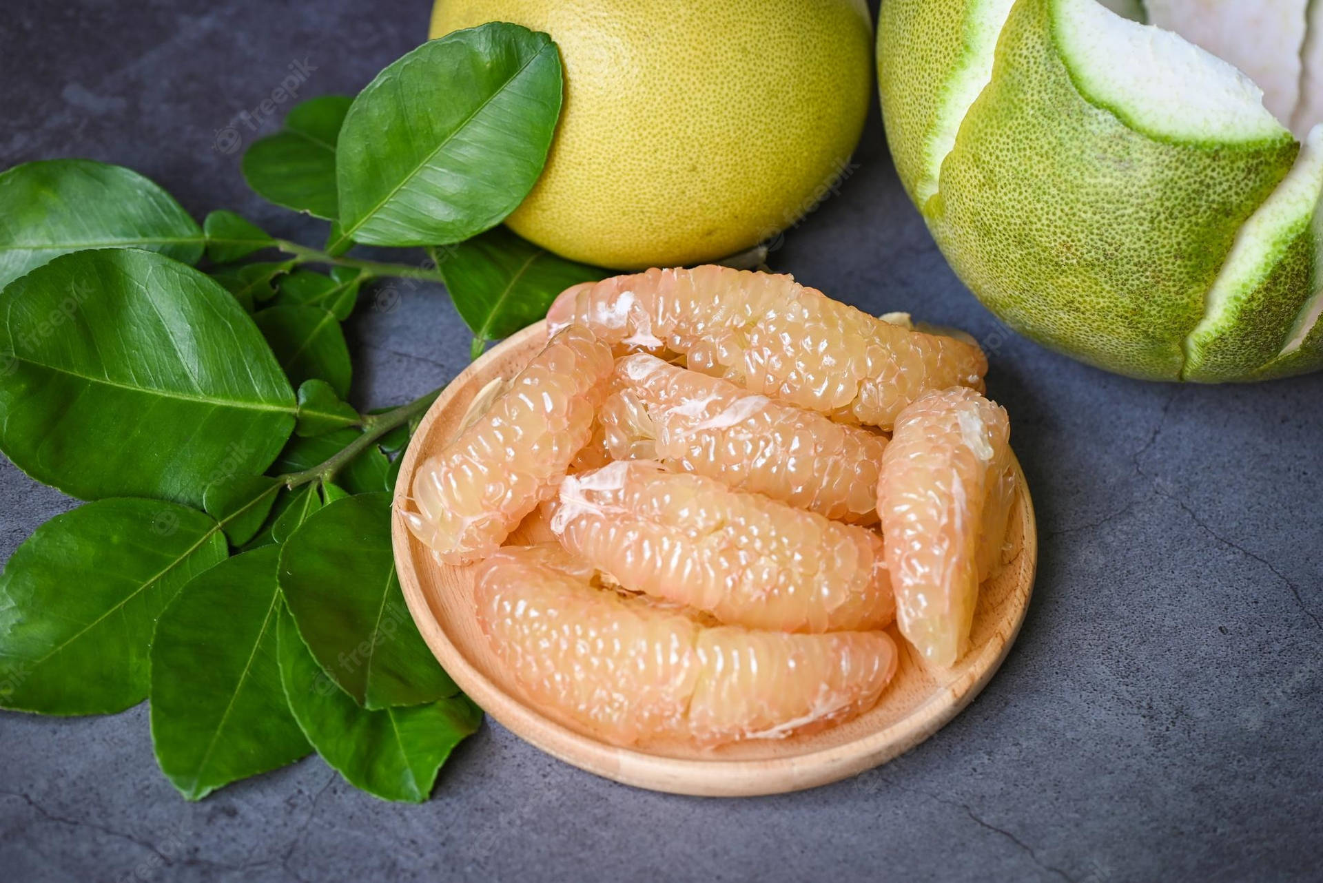 Fresh Pomelo On Wooden Table Background