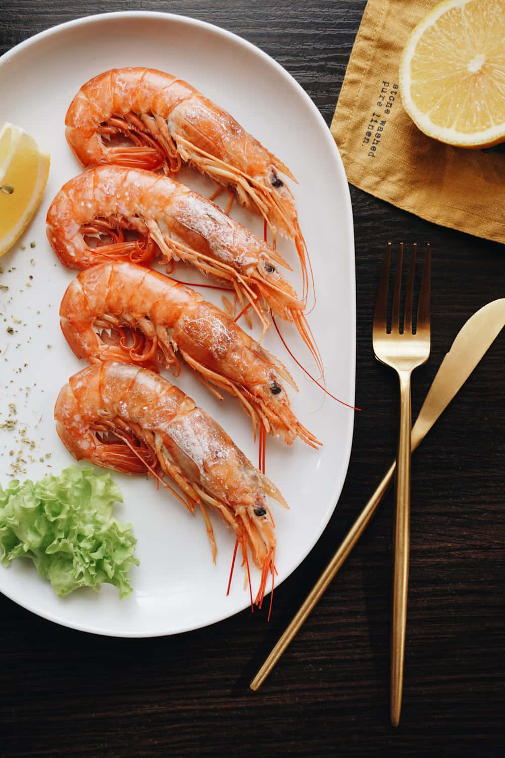 Fresh Prawns Plated With Lemon And Greens Background